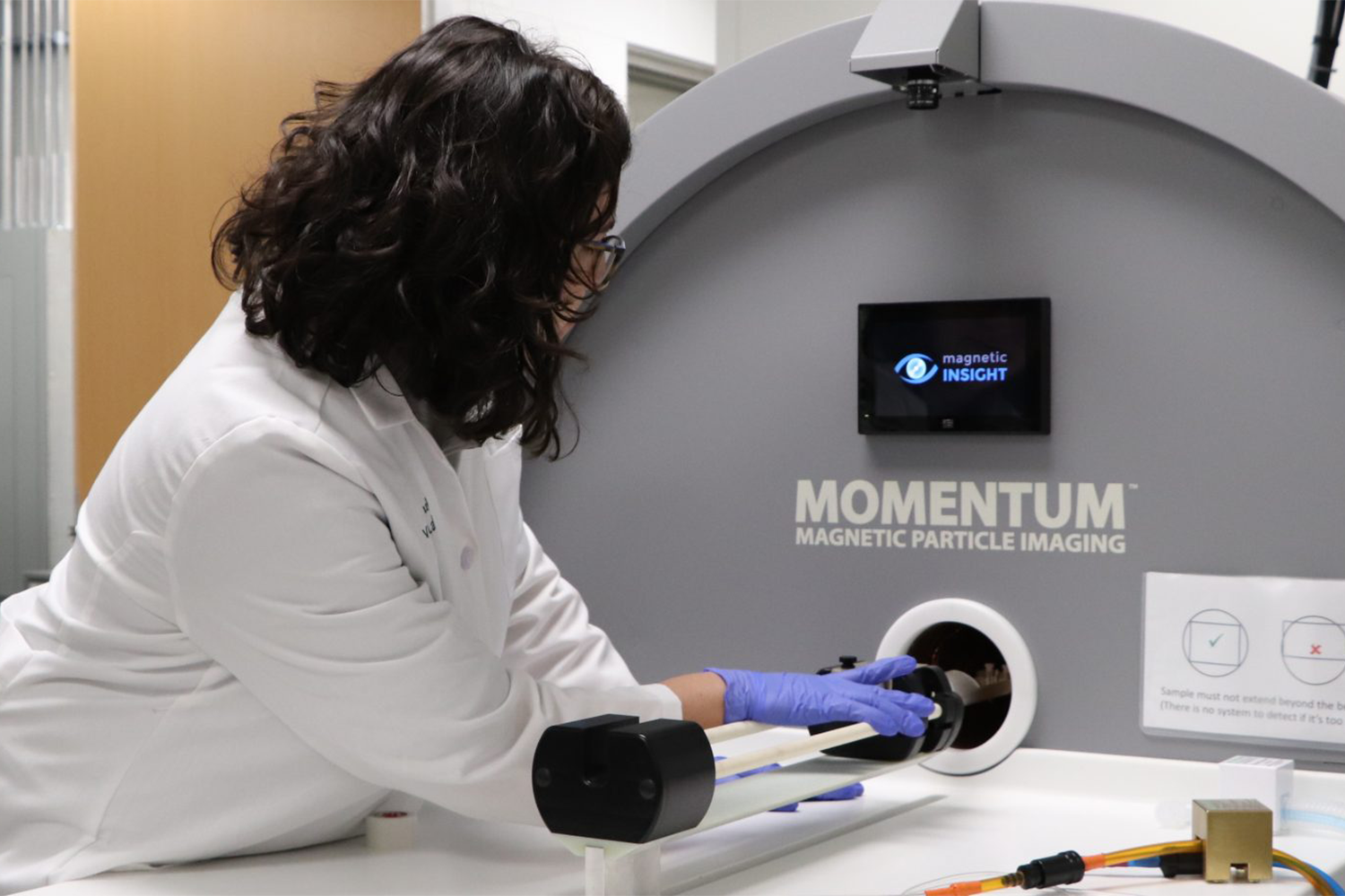 Researcher using a Magnetic Particle Imaging instrument